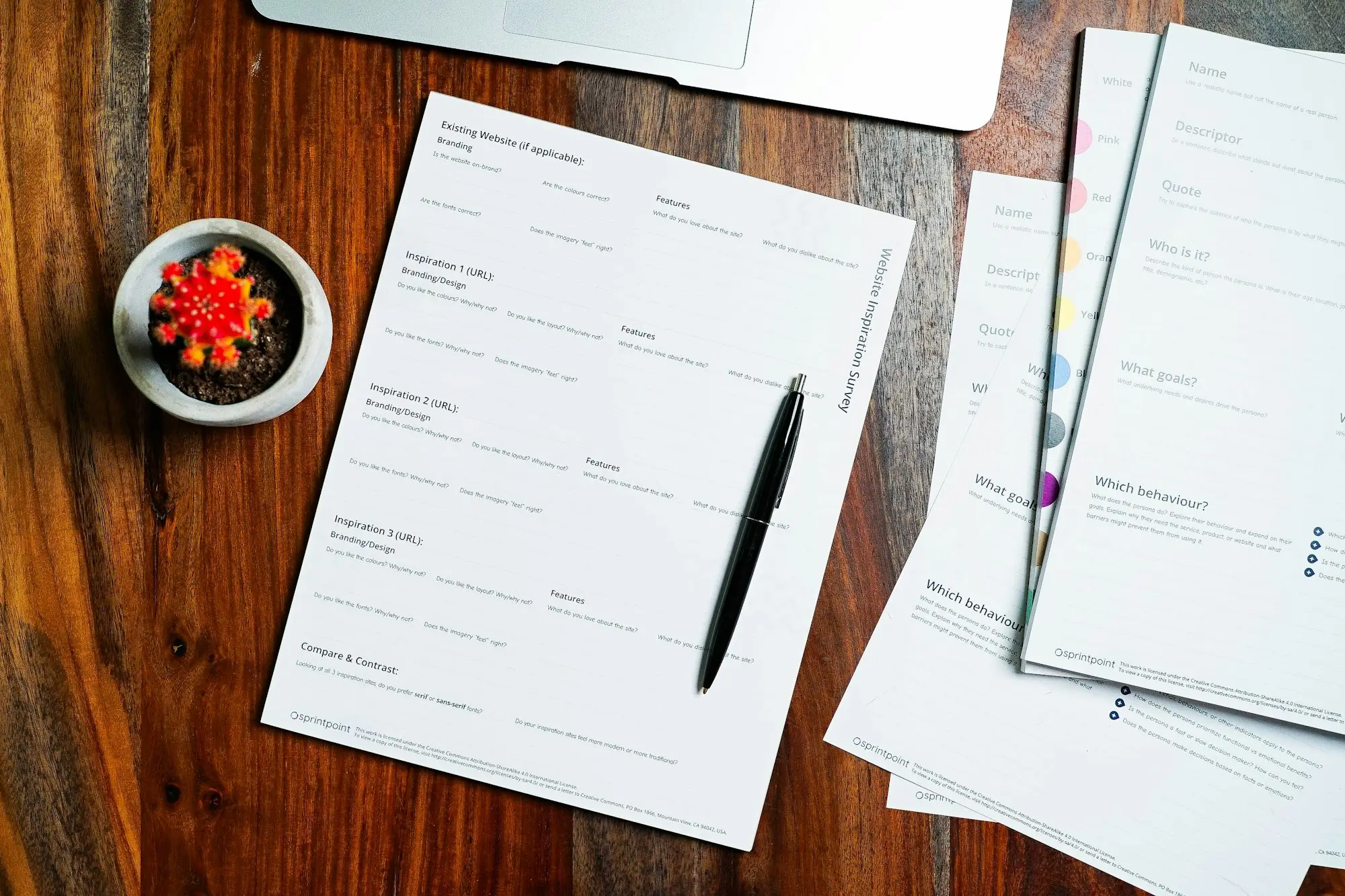 Settlement documents and a pen laid out on a conveyancer's desk