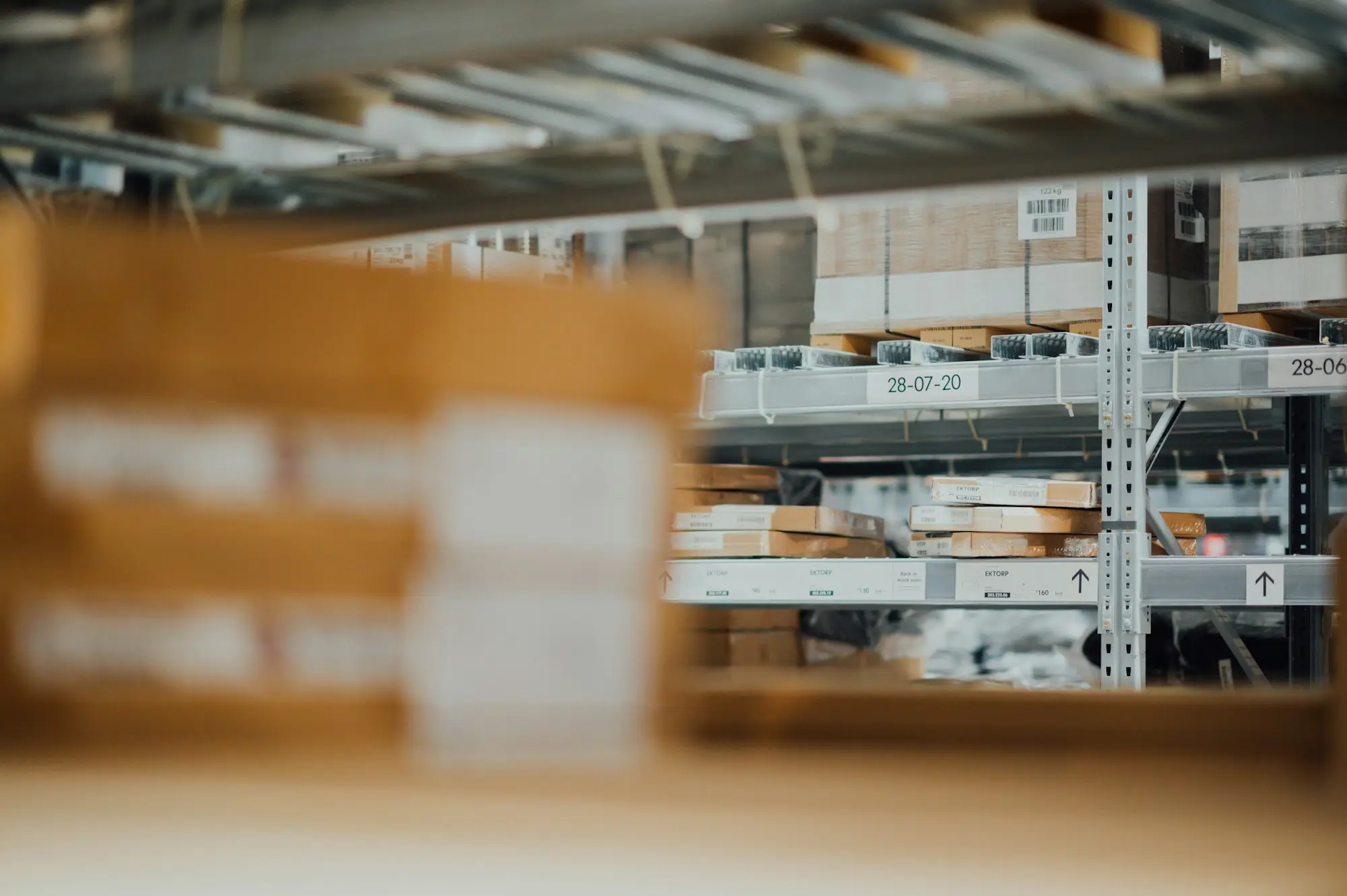 Wholesale warehouse shelving stacked with stock